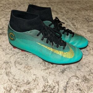 Nike Teal and Black Soccer Cleats with Gold Swoosh